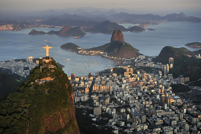 Christ, symbol of Rio de Janeiro, standing on top of Corcovado Hill, overlooking Guanabara Bay and Sugarloaf, Rio de Janeiro, Brazil