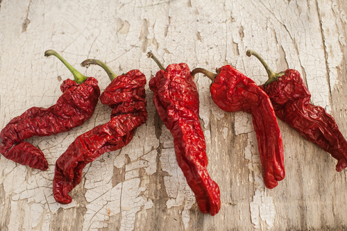 Red Sun-Dried Pepper a basket on wooden table